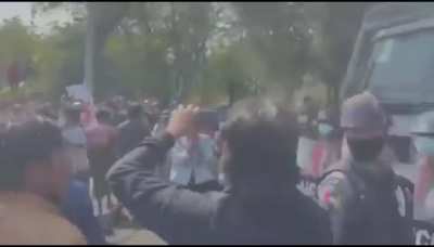 Remarkable scenes in Myanmar: Police openly join protesters as they are being shot with water cannon