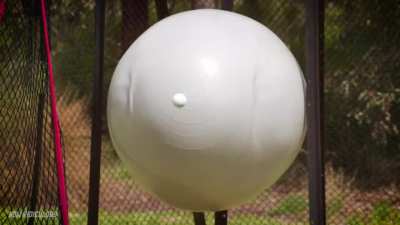 Golf Ball hitting off of an Exercise Ball