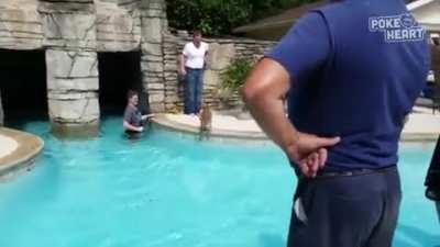 The rescuer's reaction after he gets the baby deer out of the pool...