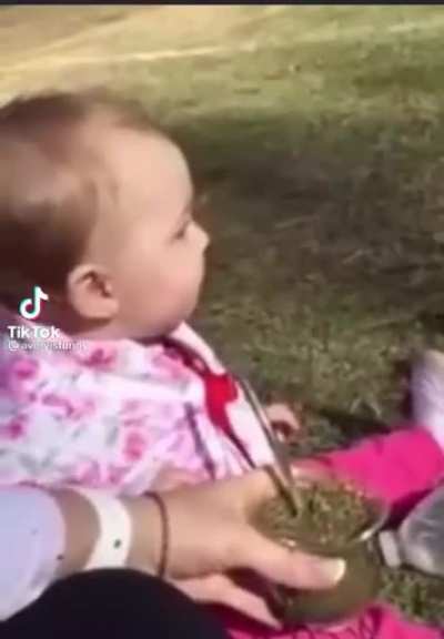Baby tries herbal tea for the first time