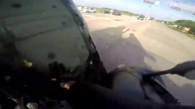 Motorbike rider survives three-way crash with a red light runner