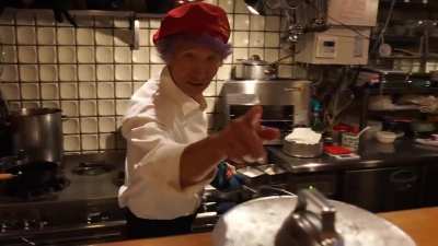 Chef Motokichi displaying his skill in cooking "Omurice", a notoriously difficult way of preparing omelette over rice.