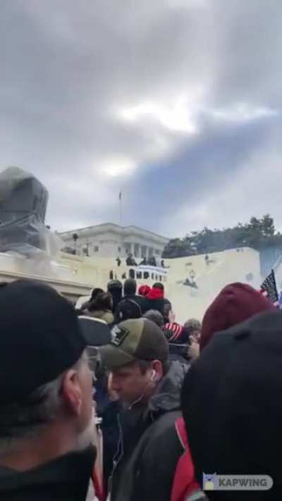 "The cops are - they're shootin off smoke bombs"