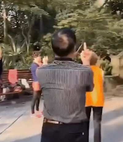 Chinese pensioners giving the "middle" finger as a form of meditation. According to a meditation teacher Megan Monahan, the middle finger represents the element of fire. It is believed that by creating different hand positions via different configurations