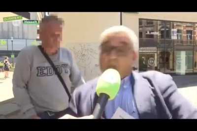 This man randomly rides into the mayor, who was giving an interview