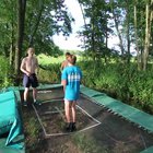 This kid flipping with his bros in the forest