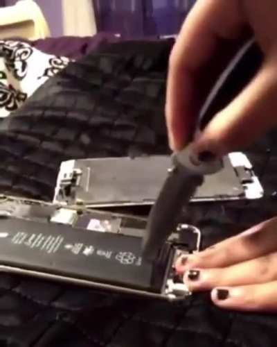 Kids "Fix" a broken phone.