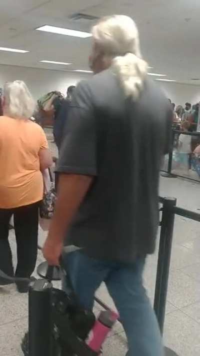Police Drug dog being used in ATL airport. A passenger was given a "suspect bag" to make sure he was on point.