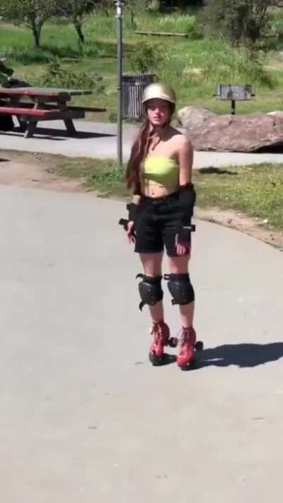 Girl does flip off ramp and lands on her toes without much effort.