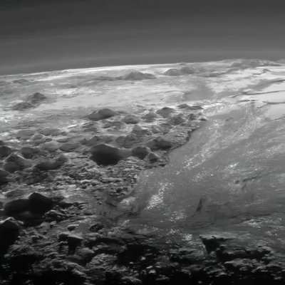 ? Pluto’s ice mountains, frozen plains and layers of atmospheric haze as seen by the New Horizons spacecraft.