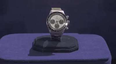 A Vietnam veteran looks up how much his Rolex is worth.