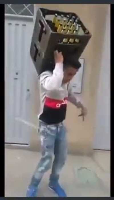 Dancing while carrying two crates of beer