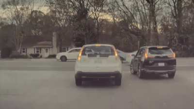 Of course the driver of the black car got pissed at the other driver for... hitting them?