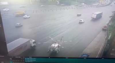 The helicopters was evacuating an injured driver from a previous crash, those cars/trucks were jumping roadblock because the didn't want to wait.