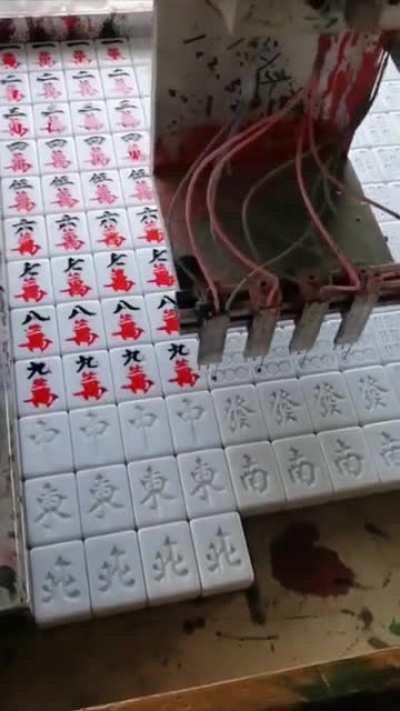 Mahjong stones getting inked