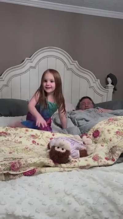 My niece getting ready to go to bed with grandma and grandpa