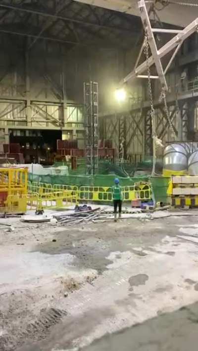 Another view of the excavator dropping into the shaft (2020-10-14)
