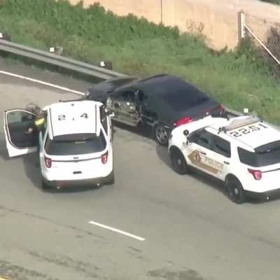 Trying to squeeze past a truck while being chased by the cops