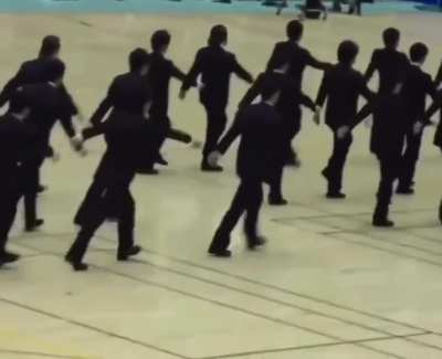 In Japan, these university students are demonstrating the art of "Shuudan Koudou" or precision synchronized walking. It teaches unity and displine, while moving towards a unified goal.