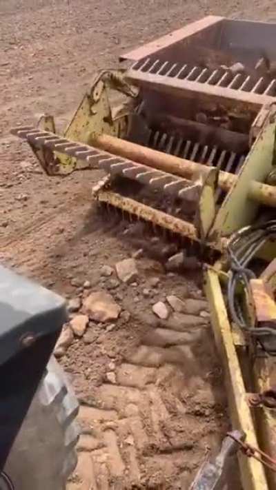 A device to clear rocks out of a field