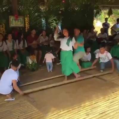 The Philippino Traditional Dance Known as "Tinikling"