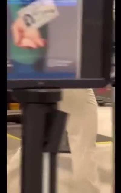 Airport security has to search this man in the back room because they didn’t believe he wasn’t carrying extra items on him person.