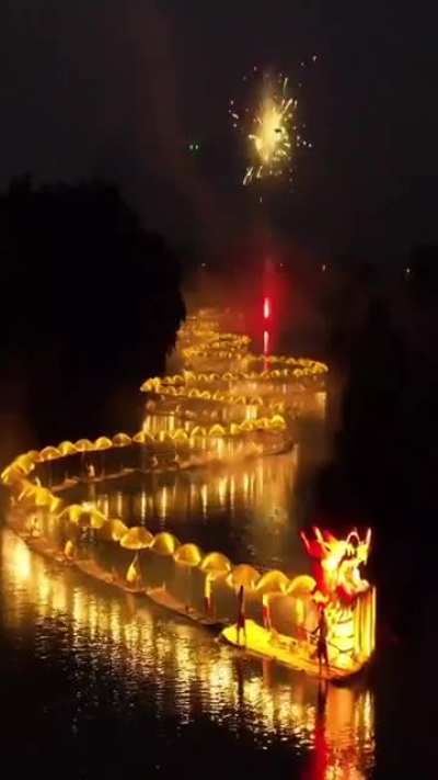 The "Golden Dragon Parade" was staged on the Yulong River in Yangshuo, Guangxi.