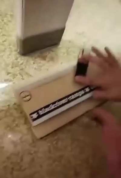 Tech deck in a bathroom stall