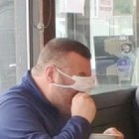 This guy enjoying a slice