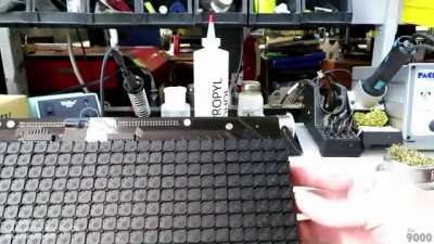 Electromechanical dot matrix "flipdot" display panel used in high-visibility environments like on a bus or on road construction signage