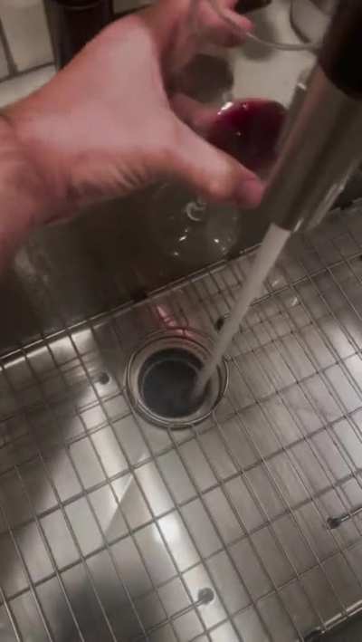 Leftover Wine turns blue when hot water is added