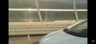Holding a phone out side the window while driving