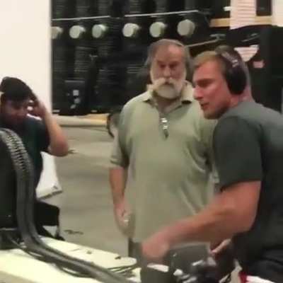 Tampa Bay Tight End Rob Gronkowski firing a minigun in preparation for the movie, "Boss Level".