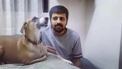Dog tries to imitate the owner