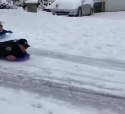 Someone called the police on kids sledding down a road so the cops investigated
