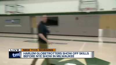 Landing a one-handed backwards half-court shot while conducting an interview on live TV... "Whaddya say about that!"