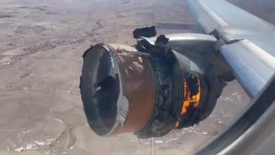 Plane engine on fire after exploding mid-flight