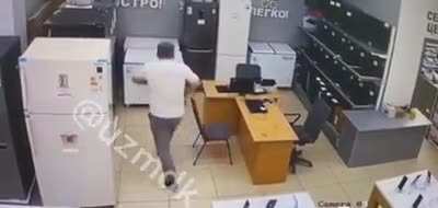 to rob a store, he climbed into the refrigerator to wait for everyone to leave...