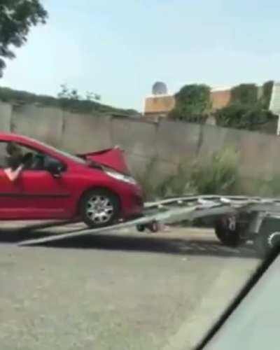 WCGW Placing the towing hook on the hood.