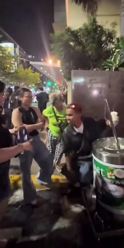 A street vendor shows his dancing skills