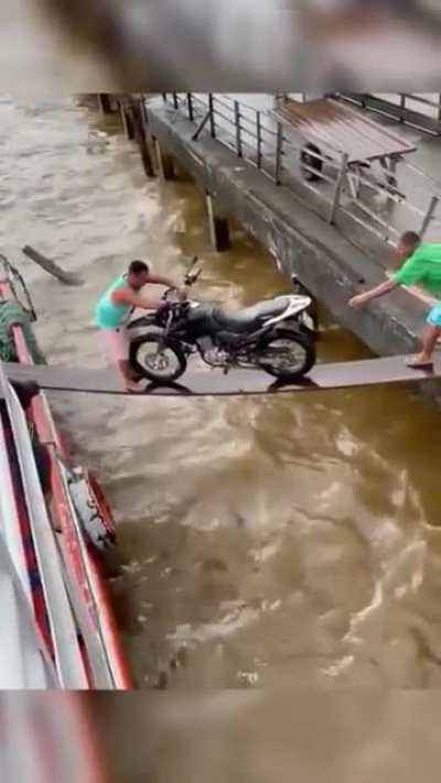WCGW pushing a motorcycle into a boat