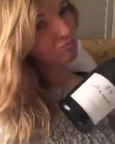 Licking a bottle of champagne