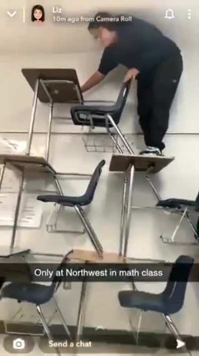 Attempting to climb a desk tower