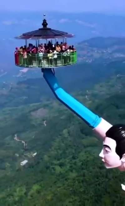 A tourist attraction in China called "Blowing Flying Kisses." (no seat belts or safety harnesses)