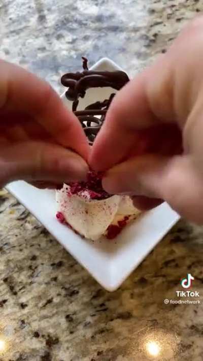 Melted chocolate freezes in place when piped on to ice water