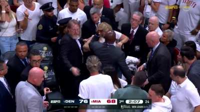[Highlight] A stretcher gets brought out for a Heat fan while the rim gets repaired