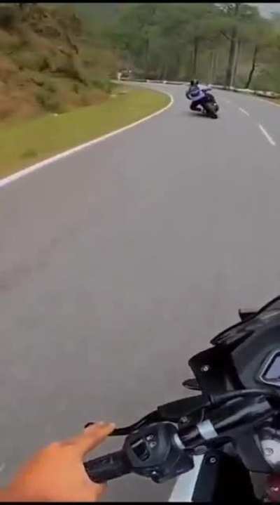 To race on a curvy road
