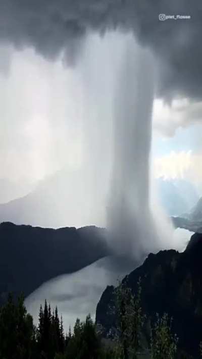 ? Raining cloud moving over lake Millstatt in Austria ?