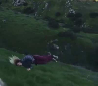 Trying to surf a grassy hill