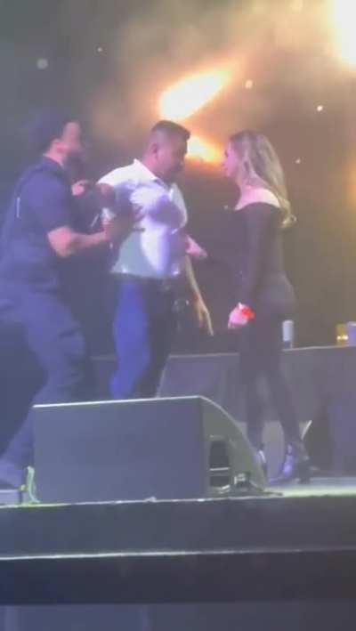 Wait! What the wife doing on stage in a full packed auditorium?!!!